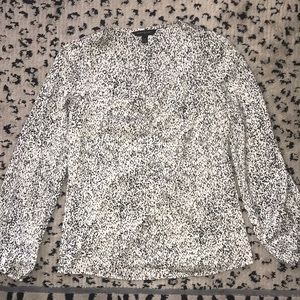 Large sleeve look dotted print top with ruching at chest.